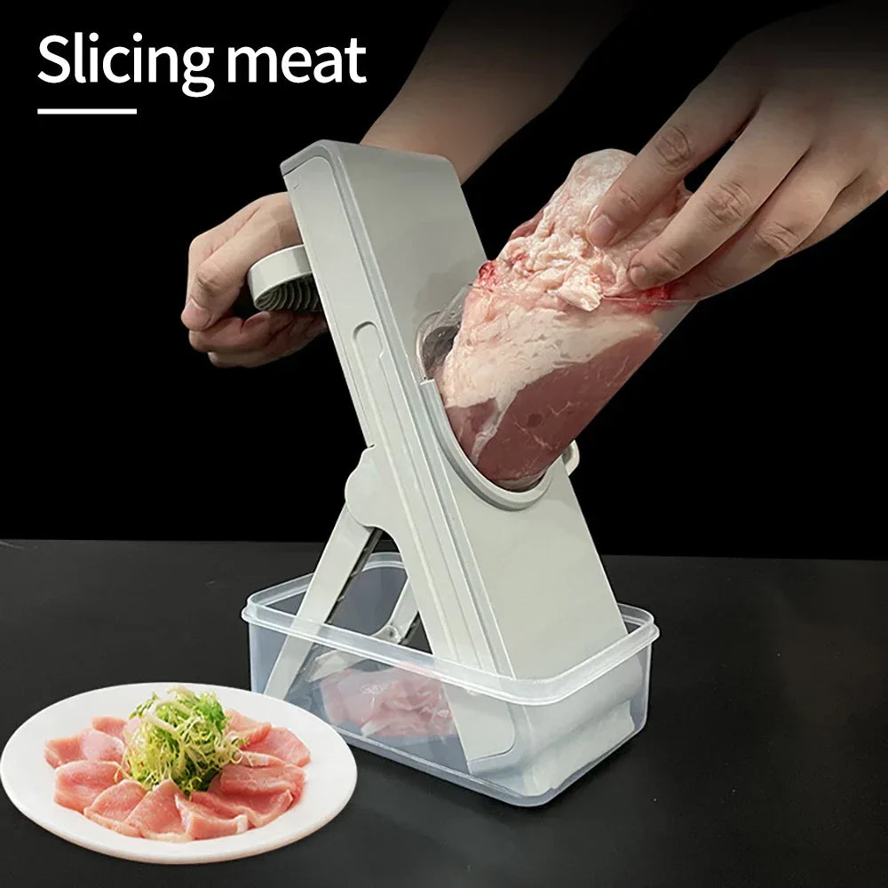 Person using a meat slicer to slice meat with a plate of sliced meat and vegetables on a black background.