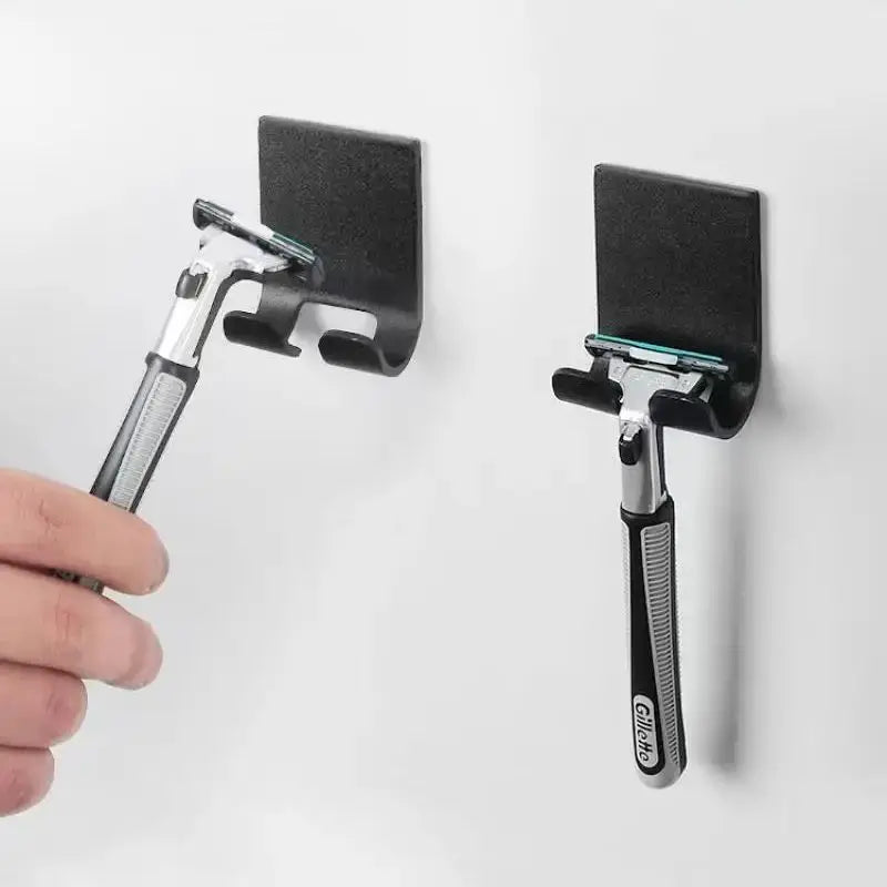 Two razors attached to black wall mounts on a white background