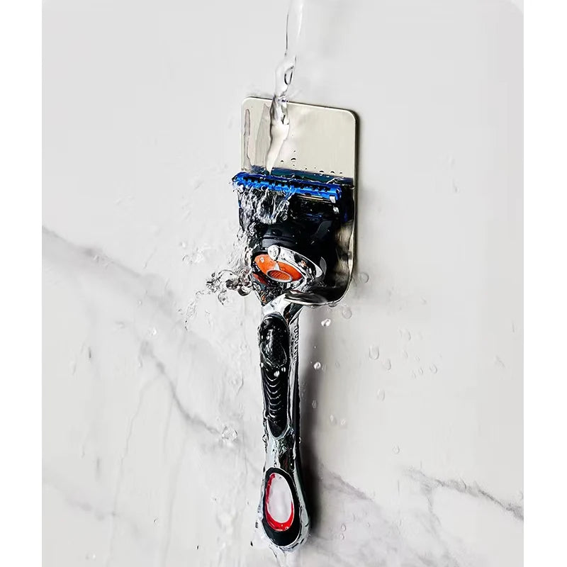 Shaving brush with water splashes on a marble background