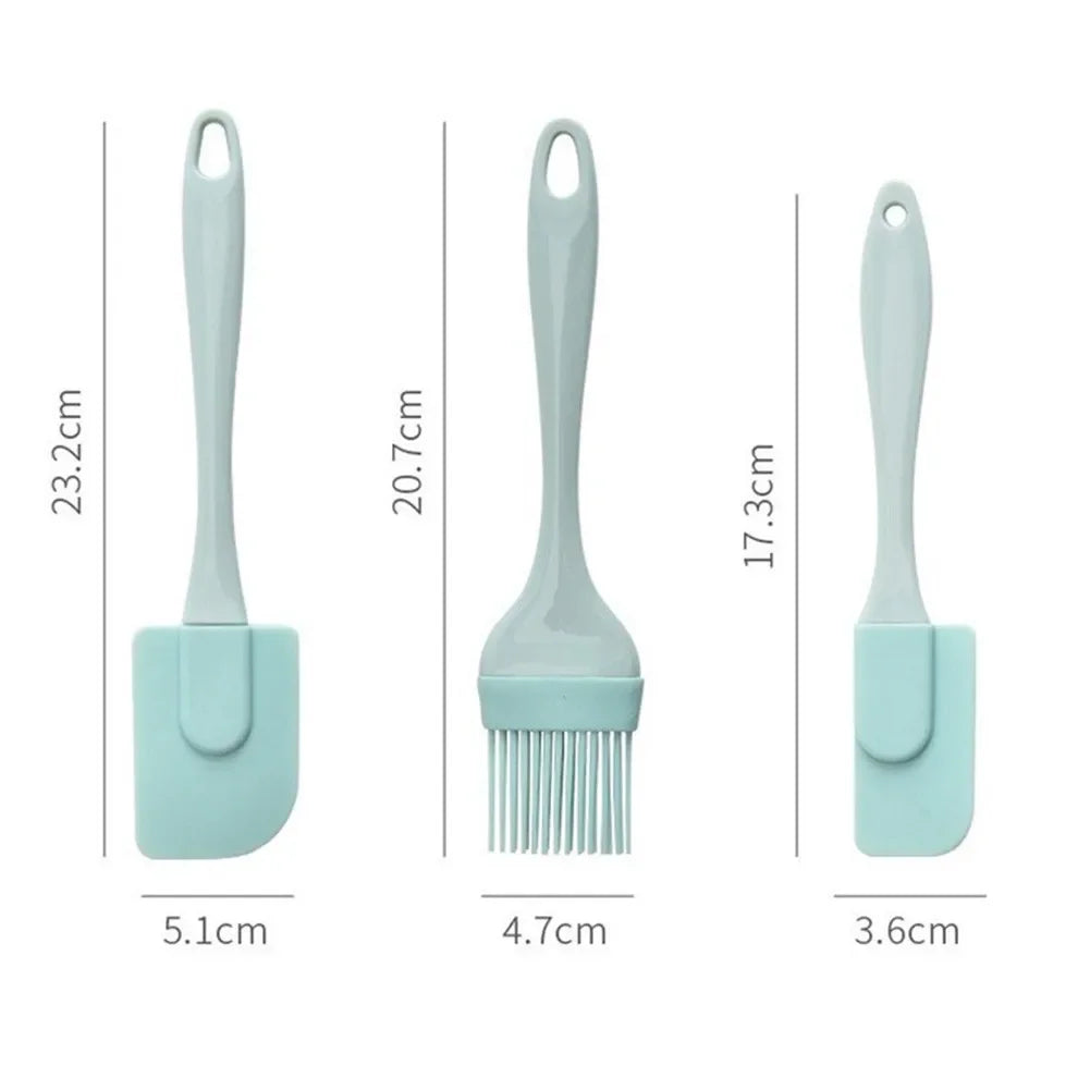 Three silicone kitchen utensils with measurements on a white background