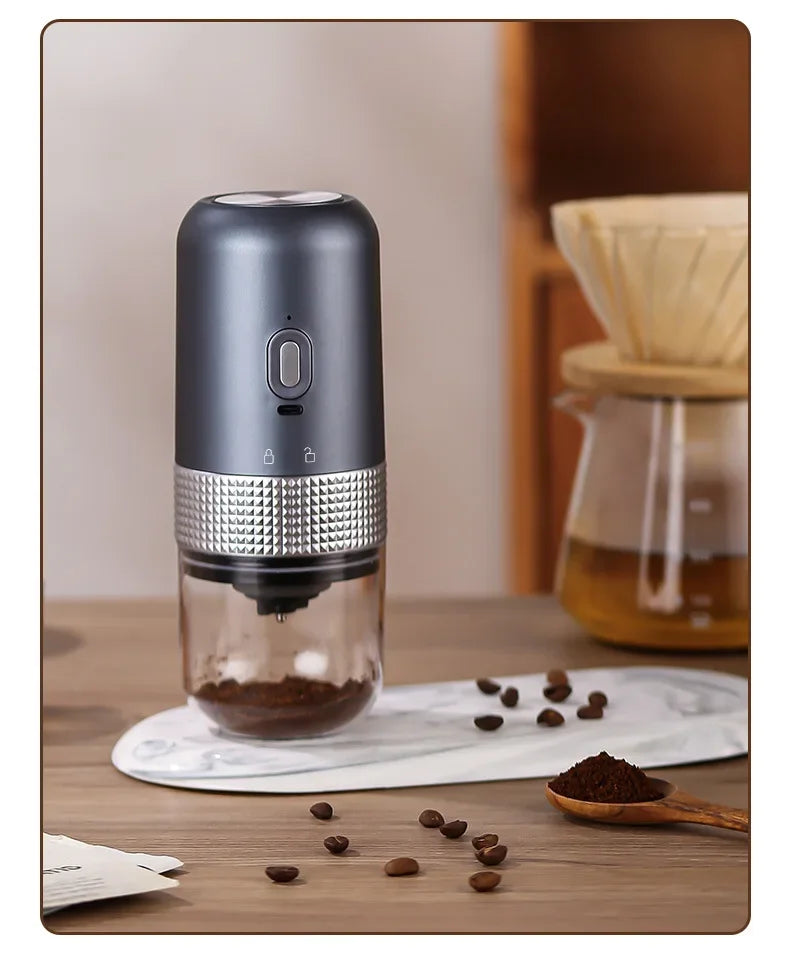 Coffee grinder with coffee beans on a wooden surface