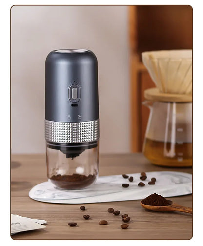 Coffee grinder with coffee beans on a wooden surface
