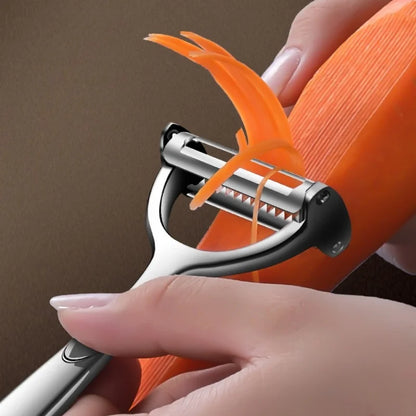 Hand using a vegetable peeler to strip an orange