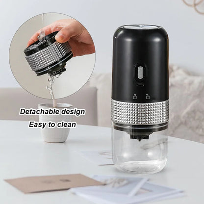 Black and silver water bottle with detachable design feature on a white surface.