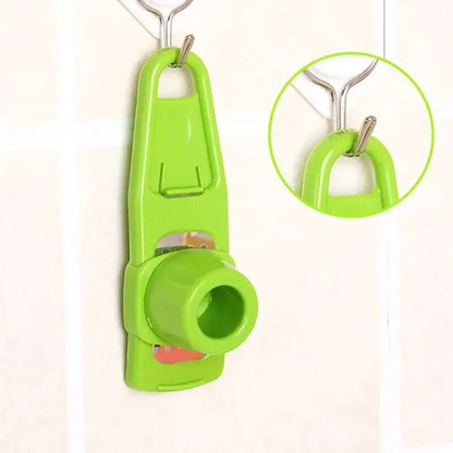 Green pet toy with a small round object on a white background