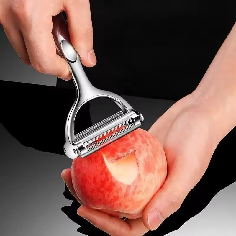 Person using a peeler to remove skin from a peach with a black background