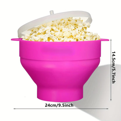 Pink silicone popcorn maker filled with popcorn on a white background