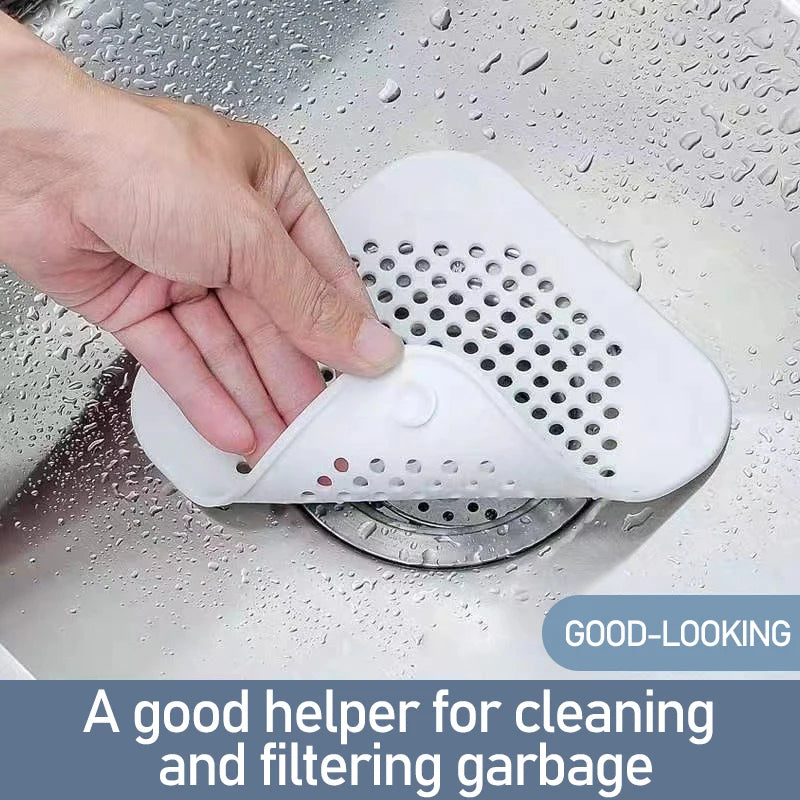 Hand using a white drain cover in a sink with text 'A good helper for cleaning and filtering garbage'.