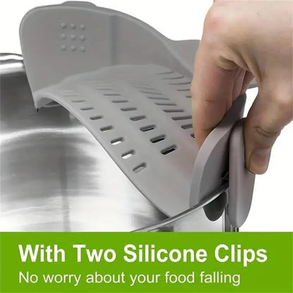 Kitchen sink strainer with silicone clips being used to catch food debris.