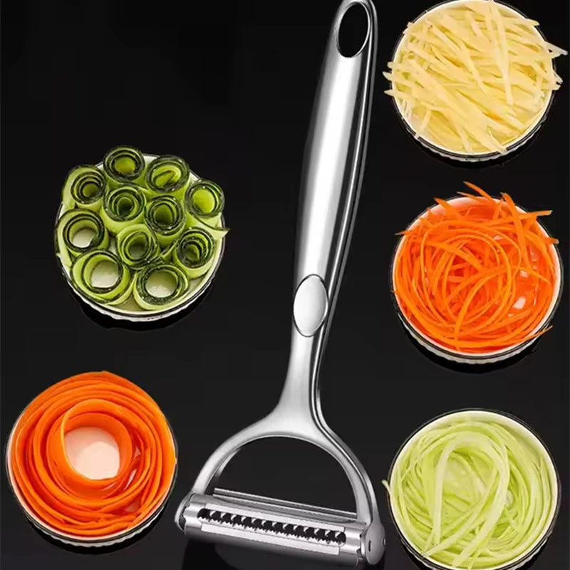 Vegetable peeler with interchangeable attachments on a black background