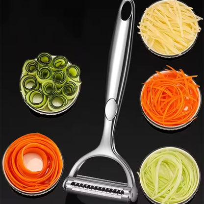 Vegetable peeler with interchangeable attachments on a black background