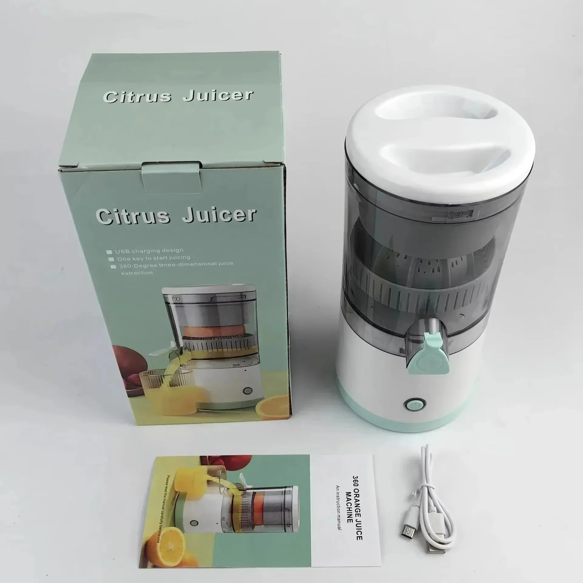 Citrus juicer with packaging and user manual on a light gray background