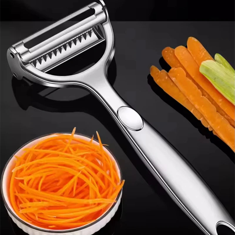 Vegetable peeler with sliced carrots and a bowl of carrot sticks on a black background