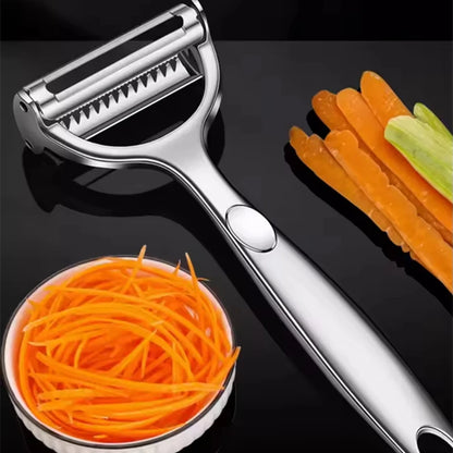 Vegetable peeler with sliced carrots and a bowl of carrot sticks on a black background