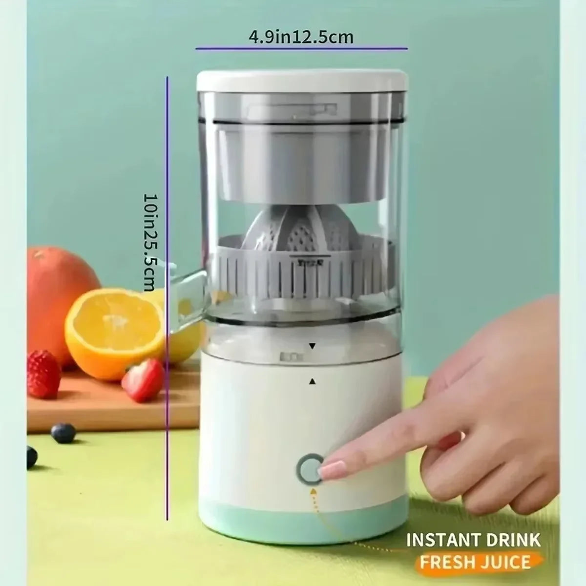 Small juicer with dimensions and a hand pressing a button, surrounded by fruits on a light green background.