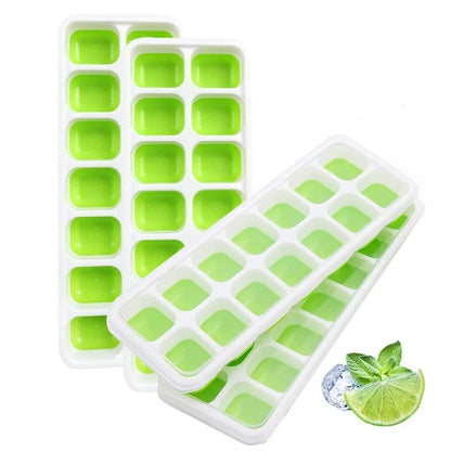 Green silicone ice cube trays with a small lime and ice cube on a white background